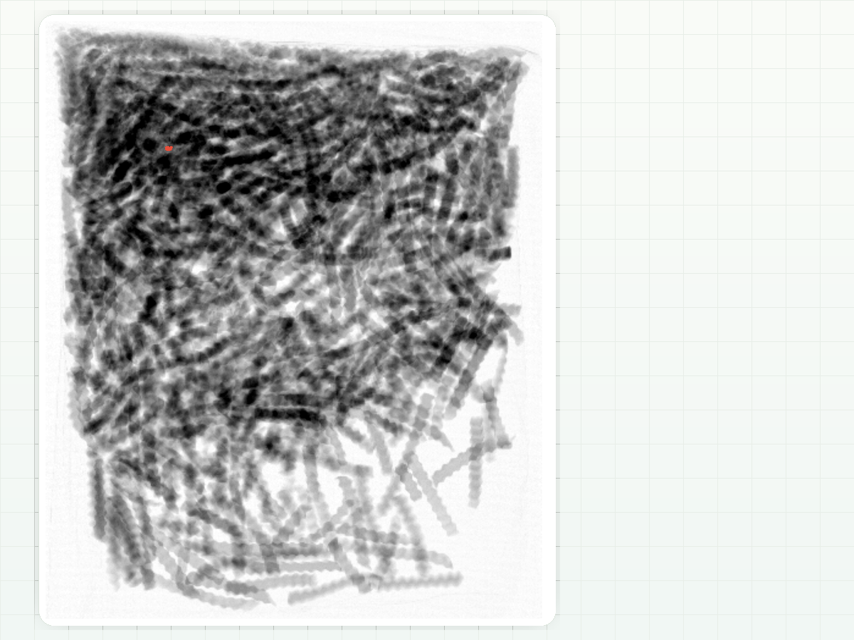 X-ray image of a finished food product with a small red detector region marking a metal fragment.