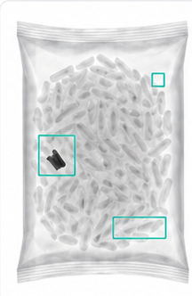 X-ray inspection image with AI detection overlays highlighting product signals.